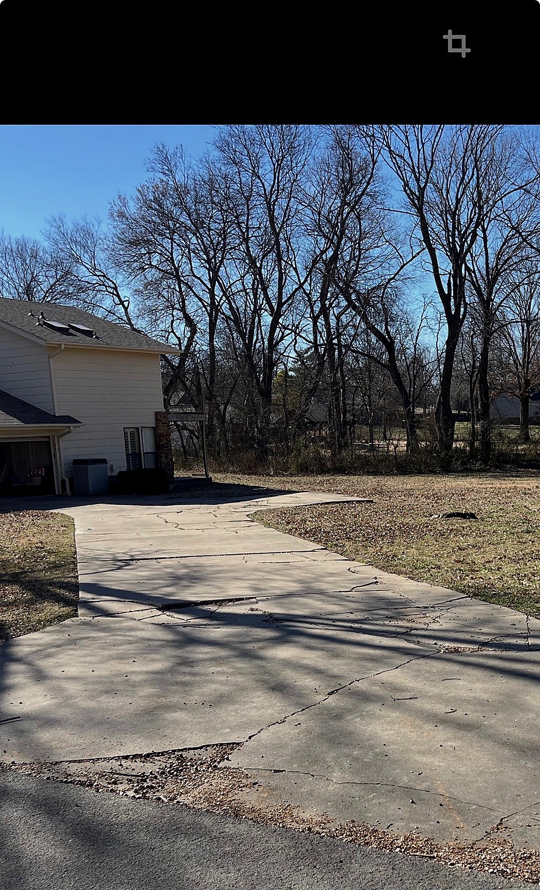 Cracked driveway before replacement in Broken Arrow