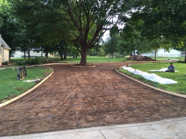 Stamped concrete driveway preparation with rebar grid Tulsa Oklahoma