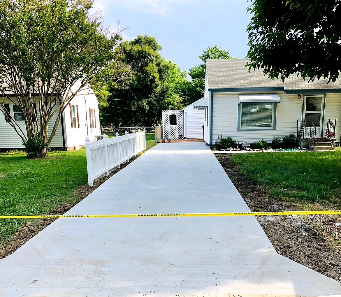 Long concrete driveway replacement in Tulsa Metro